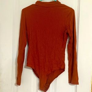 Orange long sleeve body suit